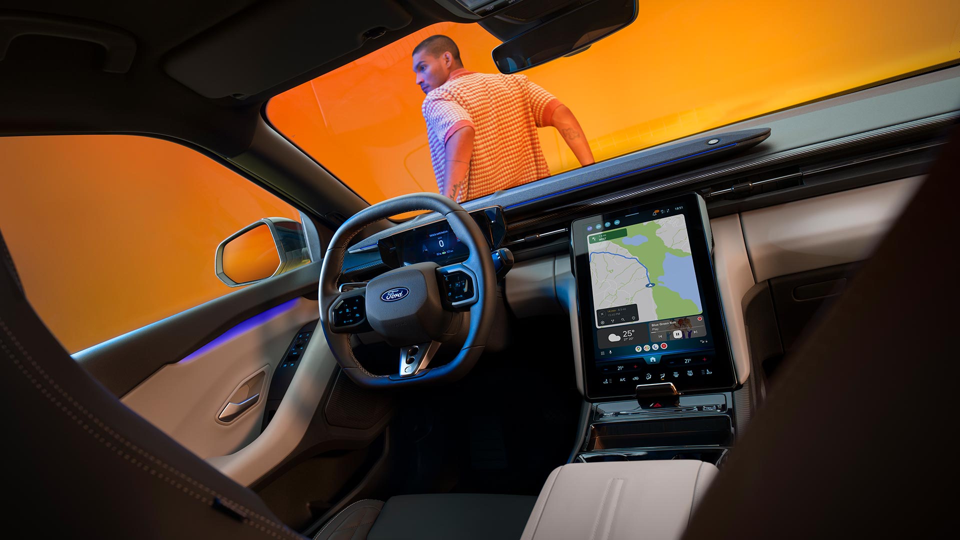 The new electric Ford Capri® interior showing large touchscreen and Cloud-connected satellite navigation system.